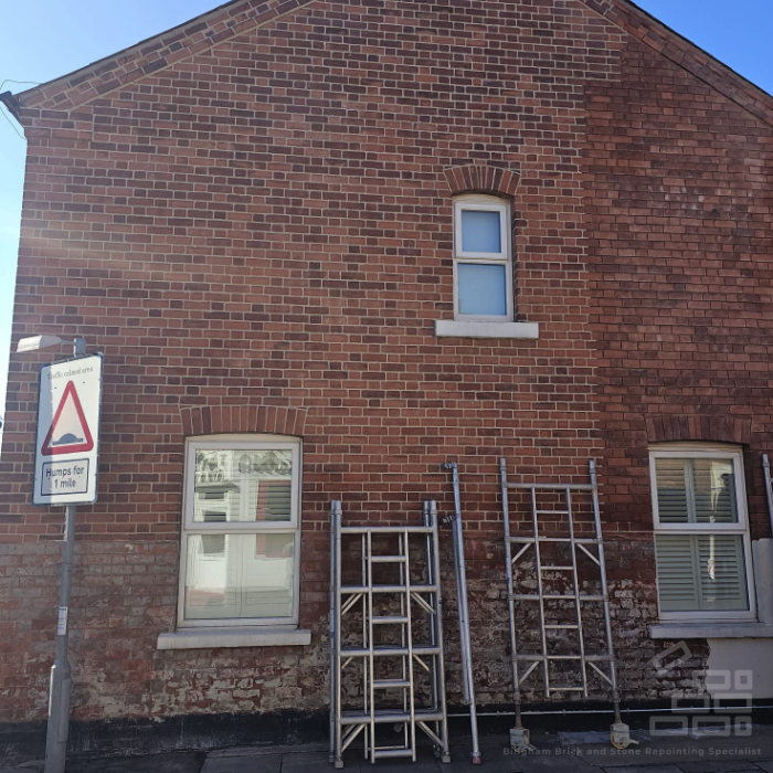 Brick repointing work being carried out